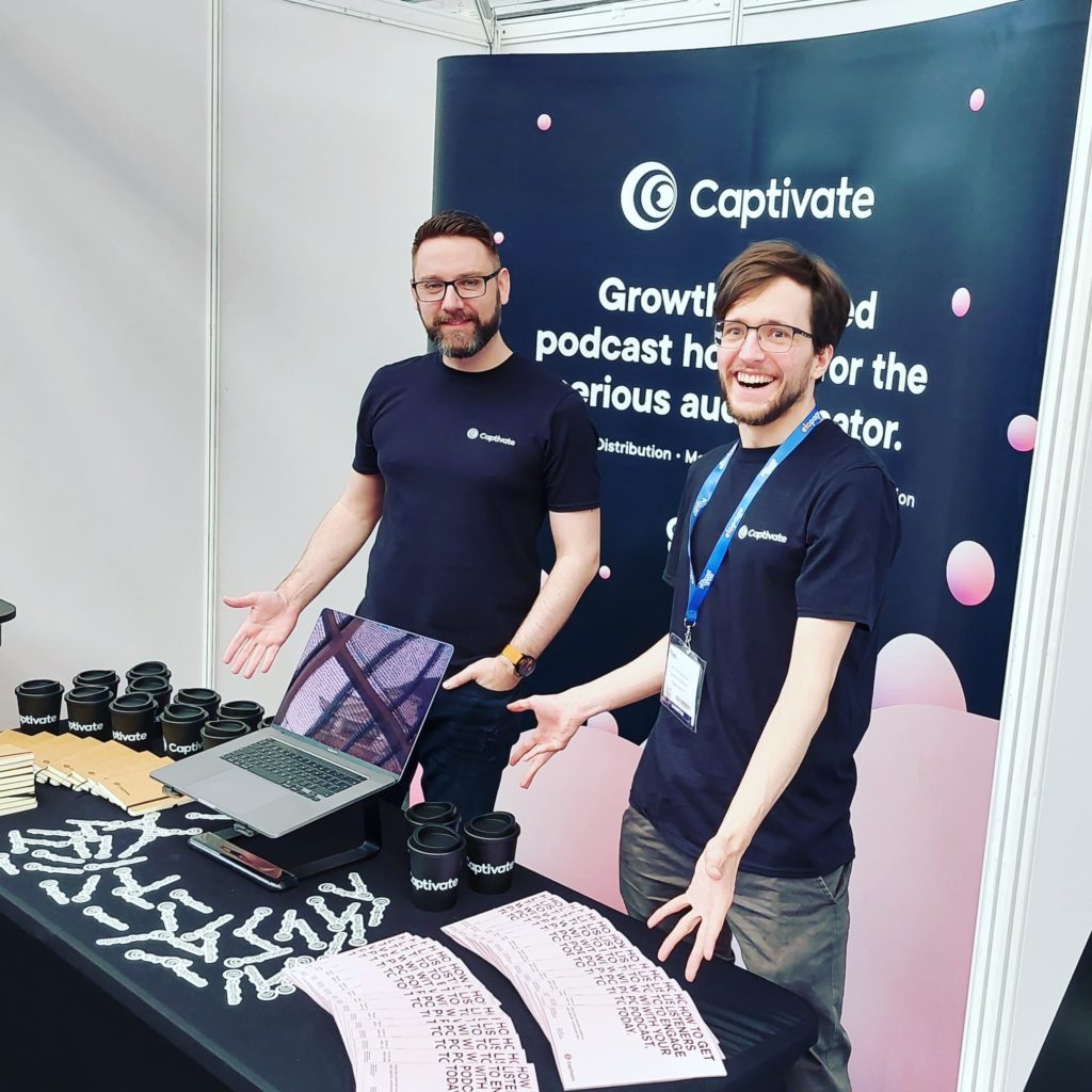 captivate-team-at-booth-at-podcast-show-2022-1